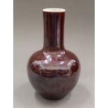 A Chinese red porcelain vase. 23 cm high.