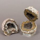 Two crystallised mineral geodes One mounted on a perspex display case. The largest 13 cm high.
