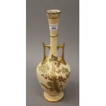 A Royal Worcester blush ivory twin handled vase. 32 cm high.