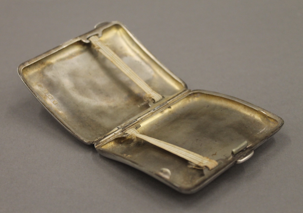 A WWI period silver cigarette case. 7 cm wide. 78.6 grammes. - Image 5 of 6