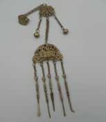 A Chinese white metal chatelaine. 33 cm high.