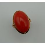 A gold and coral ring. Ring Size E/F.