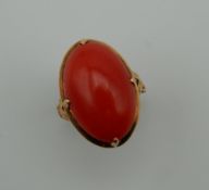 A gold and coral ring. Ring Size E/F.