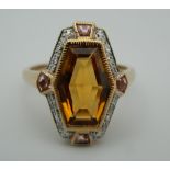 A 9 ct gold Art Deco style citrine, pink sapphire and diamond ring. Ring size L/M.