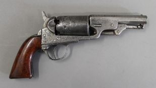 A percussion cap revolver in the style of a colt