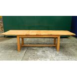 A modern two-leaf extending dining table. 300 cm long extended x 90 cm wide.