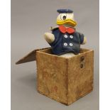 A Donald Duck jack in the box. The box 12.5 cm high.