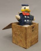 A Donald Duck jack in the box. The box 12.5 cm high.