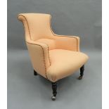 A Victorian upholstered armchair. 62 cm wide.