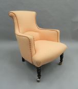 A Victorian upholstered armchair. 62 cm wide.