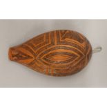 An African carved gourd wall hanging. 26 cm high.