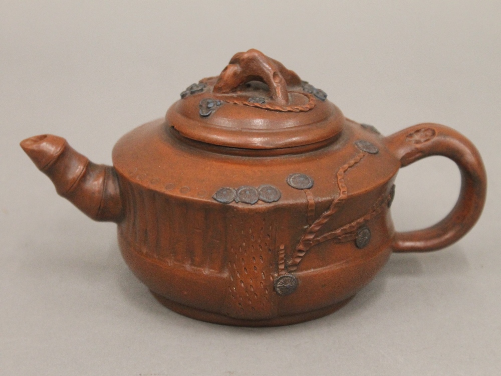 A Chinese Ying Xing teapot. 15.5 cm long.