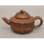 A Chinese Ying Xing teapot. 15.5 cm long.