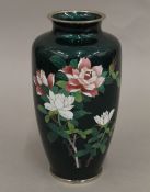 A Japanese green ground cloisonne vase. 21.5 cm high.