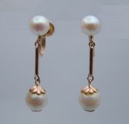 A pair of 14 ct gold pearl drop earrings