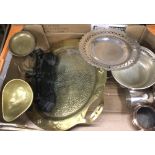 A large brass two handled hammered and stamped tray with Arts and Crafts design,