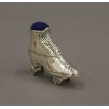 A silver pin cushion formed as a roller-skate. 3.5 cm wide.