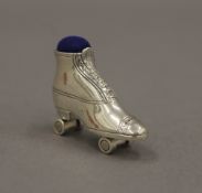 A silver pin cushion formed as a roller-skate. 3.5 cm wide.