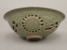 A Chinese celadon green bowl decorated with a dragon. 14.5 cm diameter.