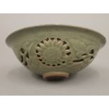 A Chinese celadon green bowl decorated with a dragon. 14.5 cm diameter.