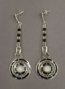 A pair of silver Art Deco style opal and black enamel earrings. 6 cm high.