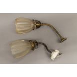 A pair of wall lights with glass shades. 24 cm high.