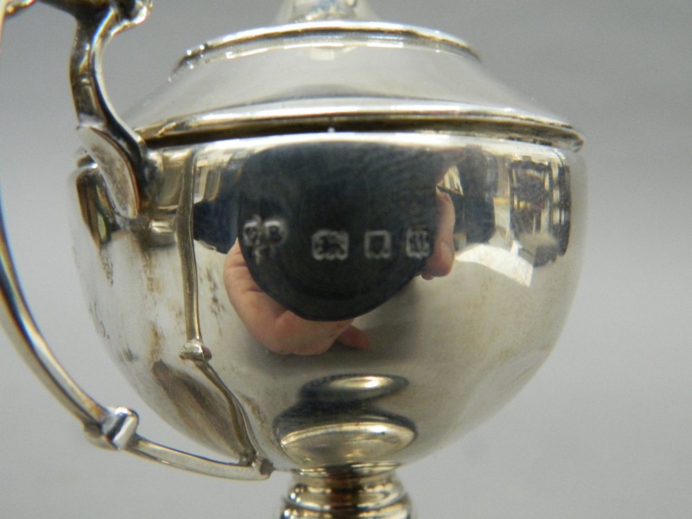 A small silver lidded trophy cup, on stand. 13.5 cm high overall. 57 grammes of weighable silver. - Image 3 of 3