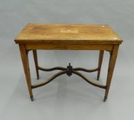 A Victorian inlaid rosewood card table. 89 cm wide.