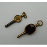 A Victorian carnelian set watch fob key and another. The former 4 cm high.