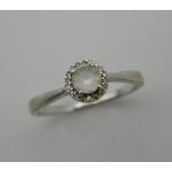 A 9 ct white gold diamond and white zircon cluster ring. Ring size N.