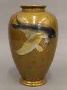 A Japanese bronze vase decorated with fish. 24 cm high.