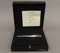 A boxed Dupont diamond set palladium pen with 18 K white gold nib. 15 cm long.