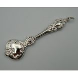 A silver rattle. 10 cm high.