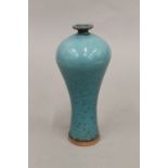 A small Chinese blue ground speckled vase. 20.5 cm high.