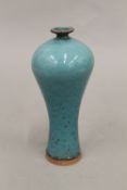 A small Chinese blue ground speckled vase. 20.5 cm high.