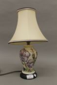 A Moorcroft Meadow Cranesbill table lamp by Alicia Amison, with matching silk shade.