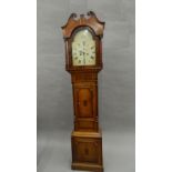 An early 19th century oak and mahogany eight-day longcase clock. 210 cm high.