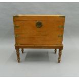 A brass bound camphor chest on stand. 68.5 cm wide.