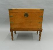 A brass bound camphor chest on stand. 68.5 cm wide.