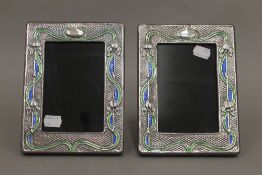 A pair of silver Art Nouveau style photograph frames. 19 cm high.