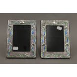 A pair of silver Art Nouveau style photograph frames. 19 cm high.