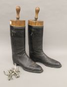 A pair of leather riding boots with spurs and boot trees. 50 cm high overall.