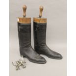A pair of leather riding boots with spurs and boot trees. 50 cm high overall.