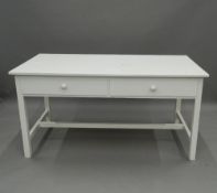 A modern white painted two-drawer table. 149 cm wide.