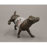 A bronze model of a dog cocking his leg. 6.5 cm long.