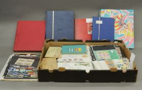 A large mixed collection of stamps contained in albums, folders,