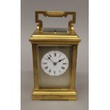 A Victorian brass cased repeating carriage clock. 18 cm high.