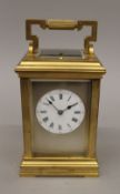 A Victorian brass cased repeating carriage clock. 18 cm high.