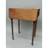 An early 19th century mahogany Pembroke worktable with bobbin twist legs. 37 cm closed.