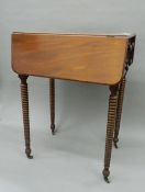 An early 19th century mahogany Pembroke worktable with bobbin twist legs. 37 cm closed.